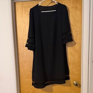 Chic Black Dress with Sheer Sleeve Details